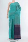 Light Blue Soft Silk Saree with Zari Butta on the body and Silk Border.  displayed on a mannequin