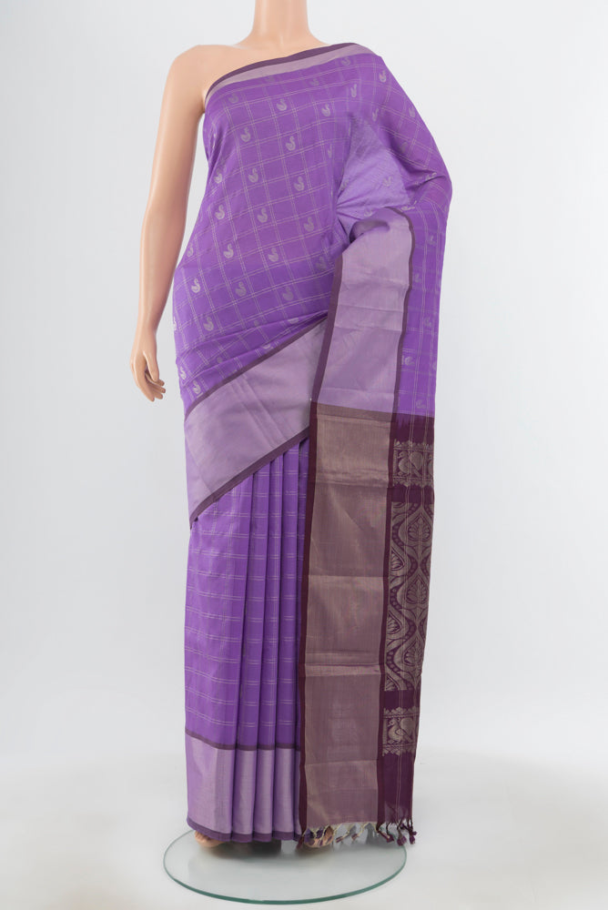 Pure Silk Pure Zari Lavender Silk Cotton Saree with Zari Butta on the body and Silk Border.  displayed on a mannequin