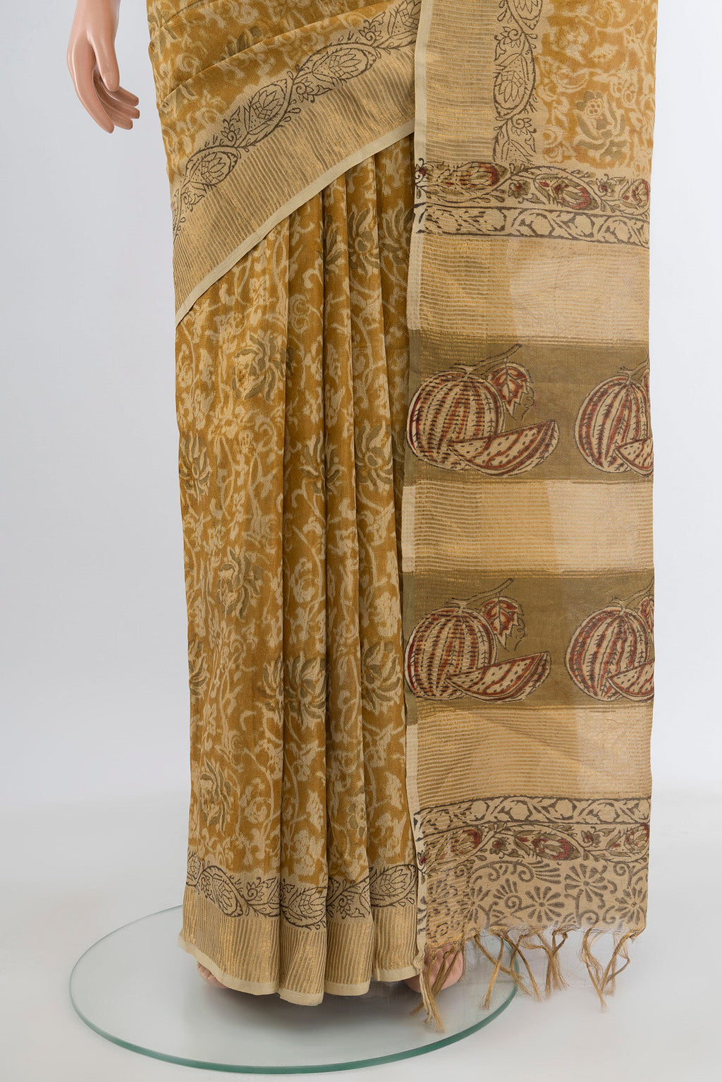 Pleats and pallu of Mustard Tussar Silk Saree with kalamkari Print on the body and Zari Border. 