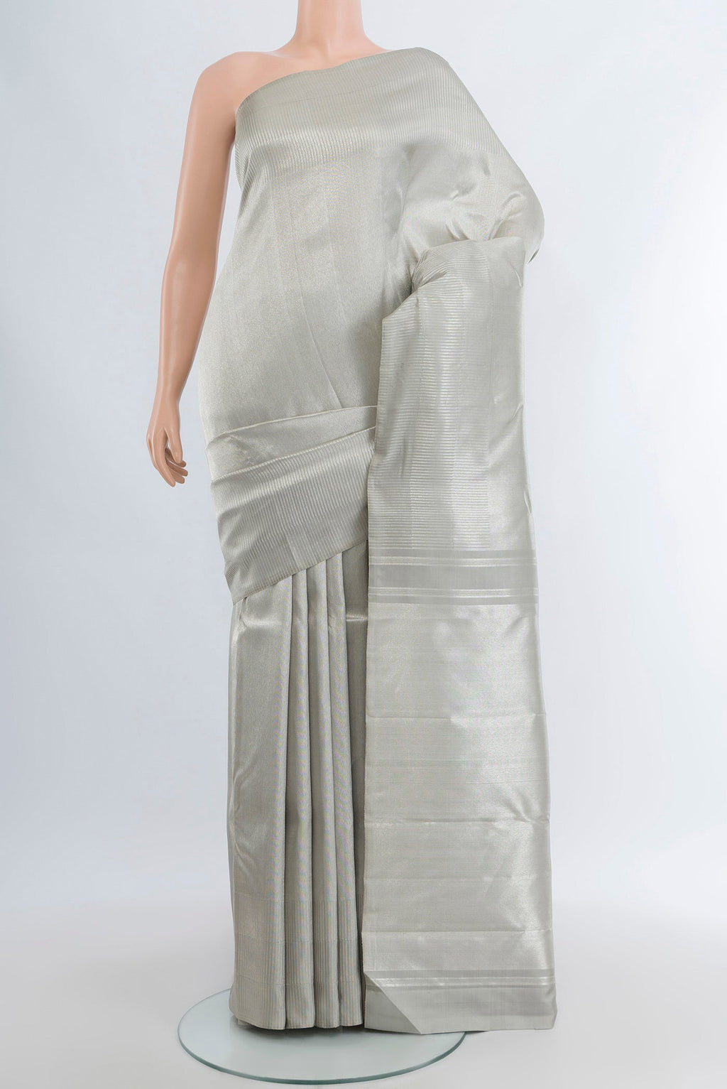 Silver Kanchipuram Silk Saree with Zari Brocade on the body and Zari Border.  displayed on a mannequin