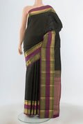 Black Kanjivaram Silk Saree with Zari Butta on the body and Zari Border.  displayed on a mannequin