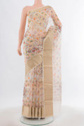 Cream Tussar Silk Saree with Floral Print on the body and Silk Border.  displayed on a mannequin