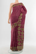 Bronze Tussar Silk Saree with Floral Print on the body and Silk Border.  displayed on a mannequin