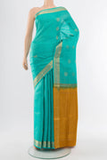 Sky Blue Soft Silk Saree with Zari Butta on the body and Silk Border.  displayed on a mannequin