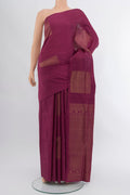 Bronze Soft Silk Saree with Zari Butta on the body and Silk Border.  displayed on a mannequin