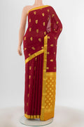 Maroon Mysore Crepe Saree with Zari Butta on the body and Zari Border.  displayed on a mannequin