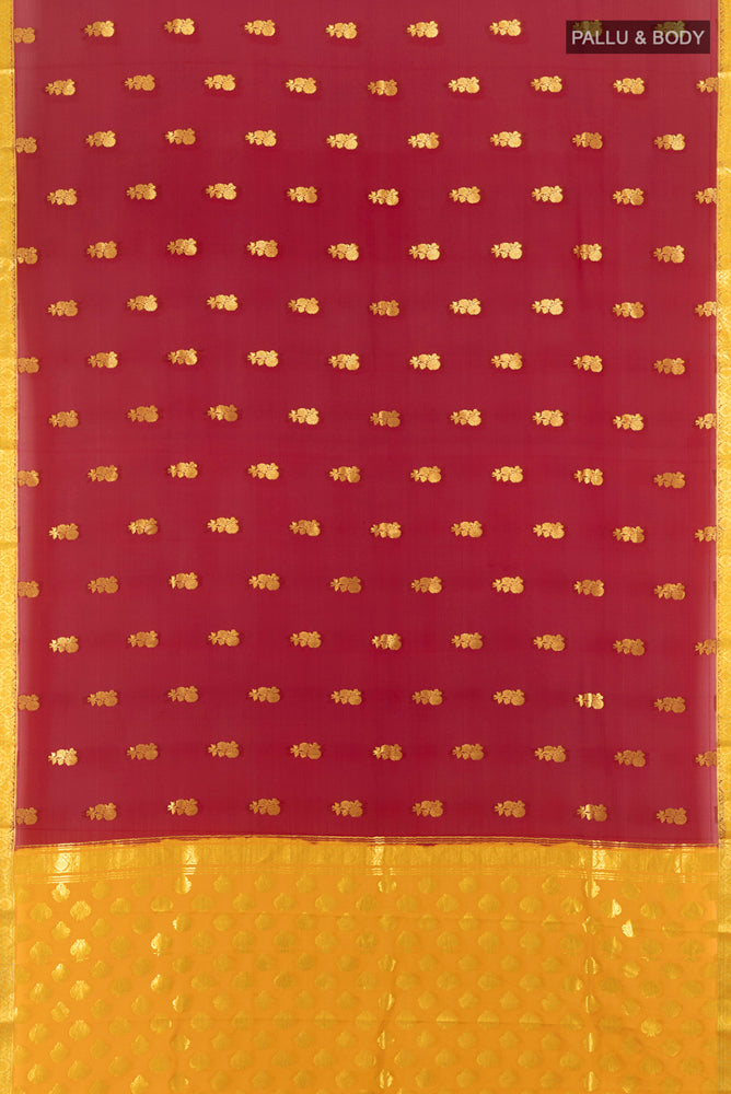 Flat view of Maroon Mysore Crepe Saree with Zari Butta on the body and Zari Border. 