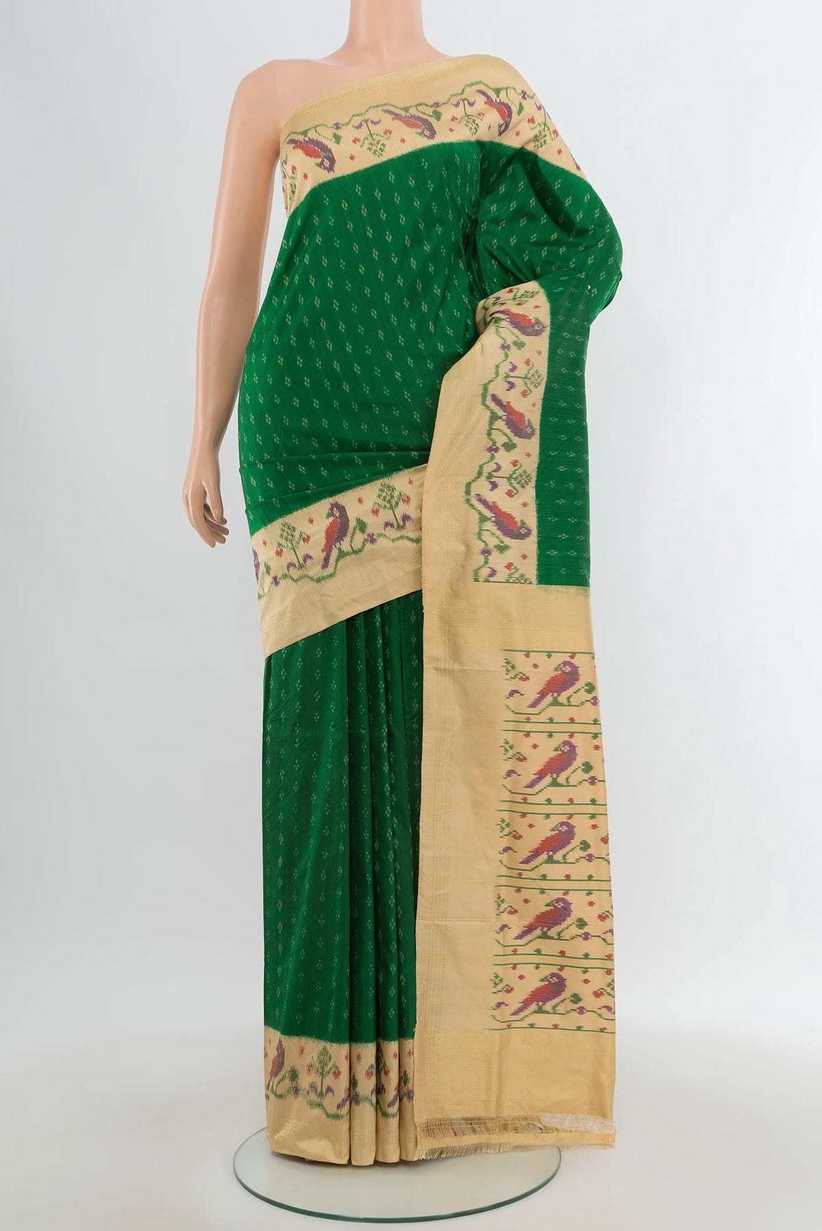 Green Pochampally Silk Saree with Pure Ikat on the body and Zari Border.  displayed on a mannequin