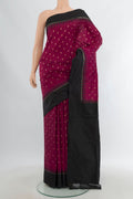 Maroon Pochampally Silk Saree with Pure Ikat on the body and Plain Border.  displayed on a mannequin