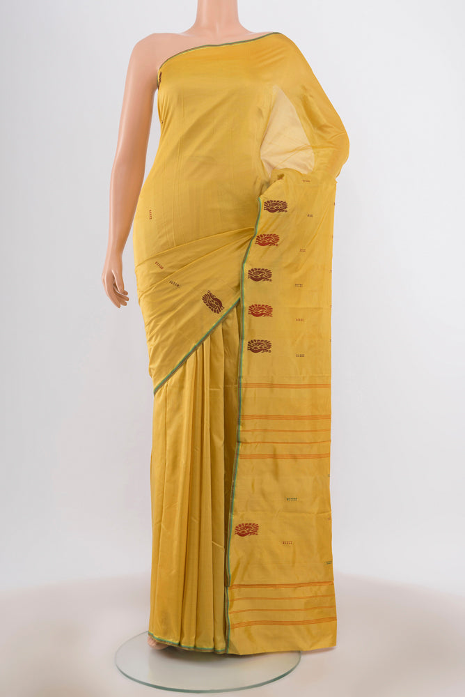 Yellow Kanchipuram Silk Saree with Thread Butta on the body and Thread Border.  displayed on a mannequin