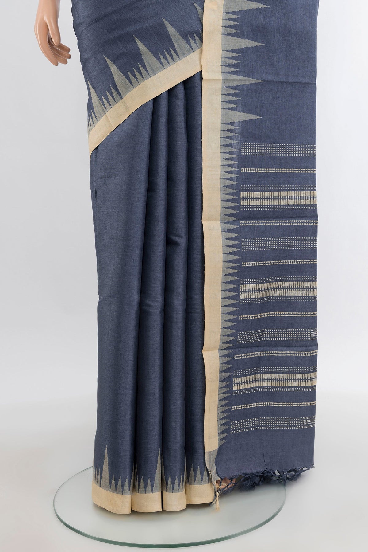 Pleats and pallu of Navy Blue Tussar Silk Saree with Plain Body and Temple Border. 