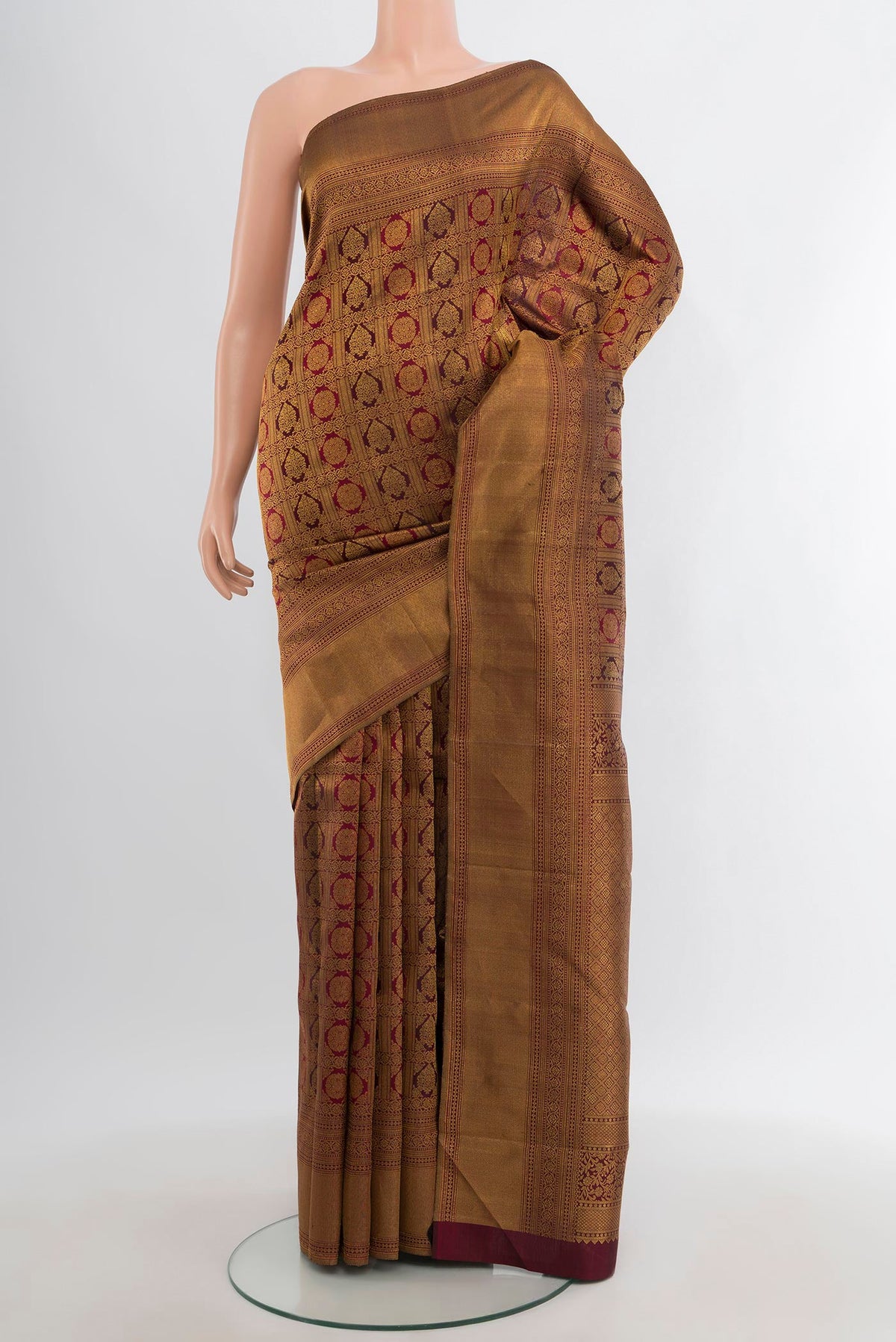 Maroon Kanjivaram Silk Saree with Zari Brocade on the body and Zari Border.  displayed on a mannequin