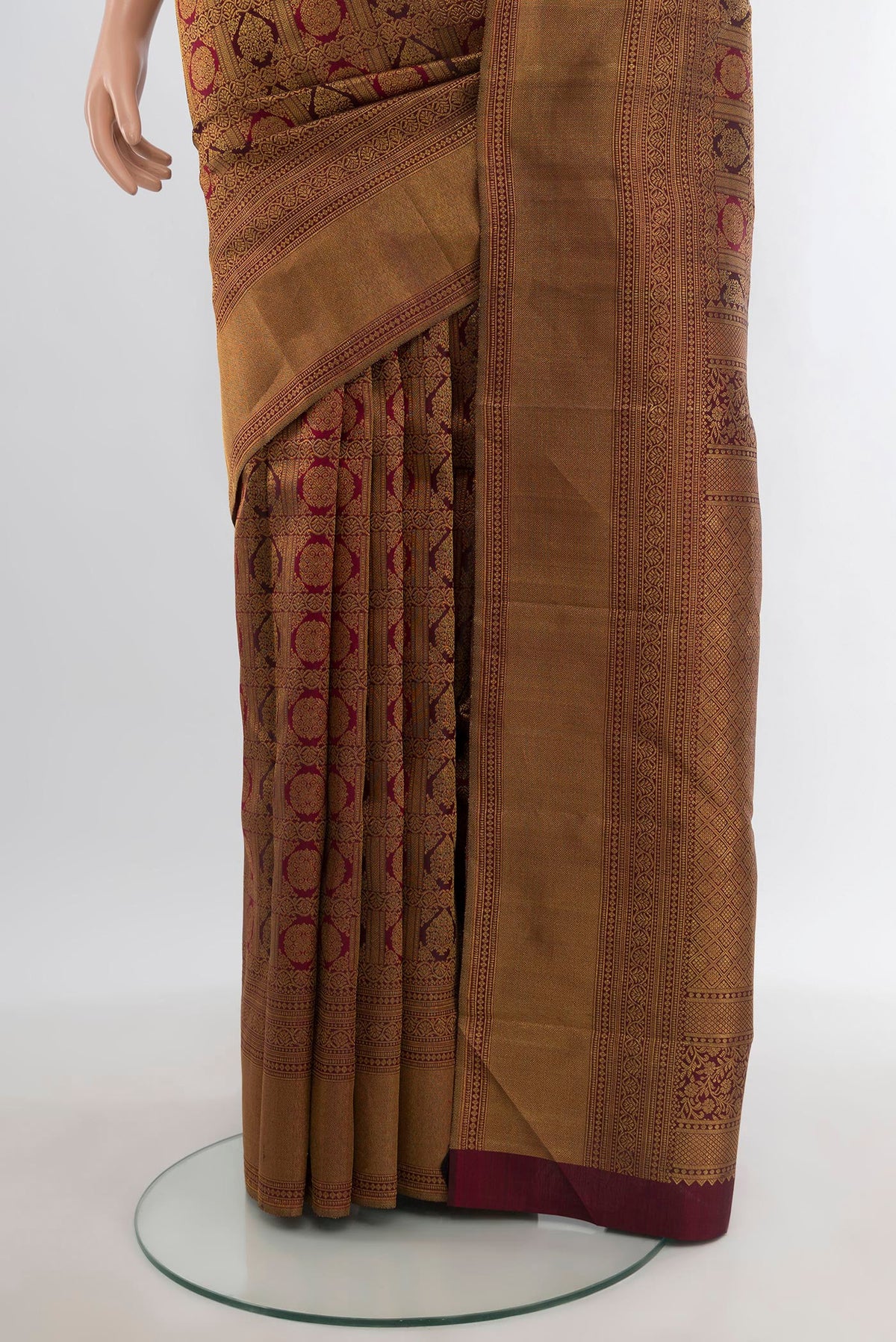 Pleats and pallu of Maroon Kanjivaram Silk Saree with Zari Brocade on the body and Zari Border. 