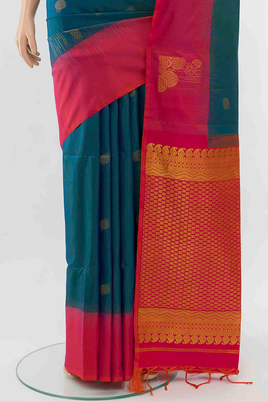 Pleats and pallu of Peacock Blue Soft Silk Saree with Zari Butta on the body and Silk Border