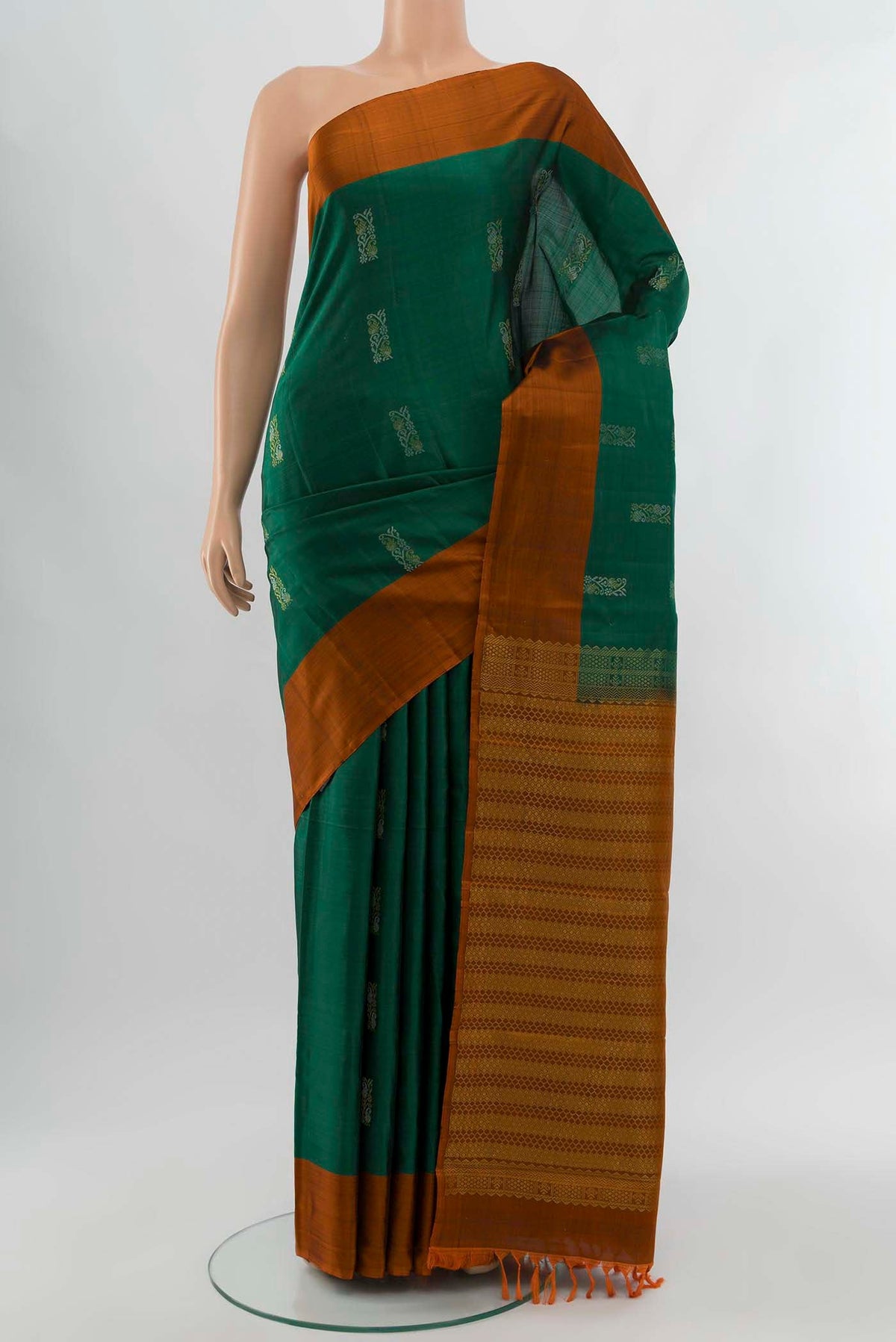 Bottle Green Kanchipuram Silk Saree with Zari Brocade on the body and Silk Border displayed on a mannequin