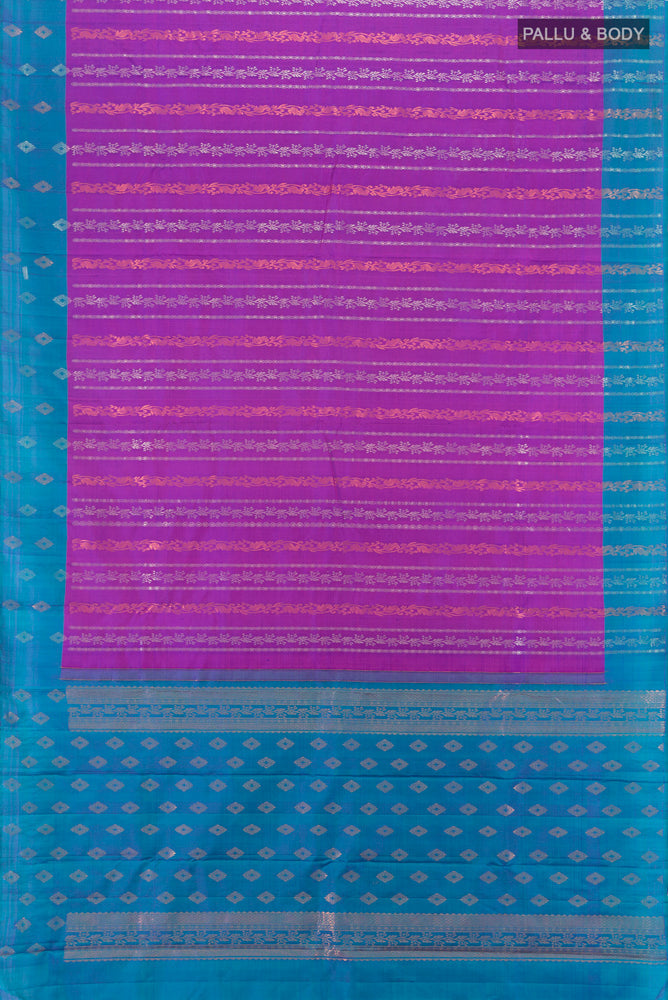 Flat view of Purple Kanchipuram Silk Saree with Zari Butta on the body and Silk Border. 