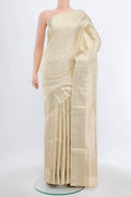 Cream Soft Silk Saree with Zari Butta on the body and Silk Border.  displayed on a mannequin