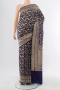Navy Blue Banarasi Silk Saree with Zari Butta on the body and Silk Border.  displayed on a mannequin