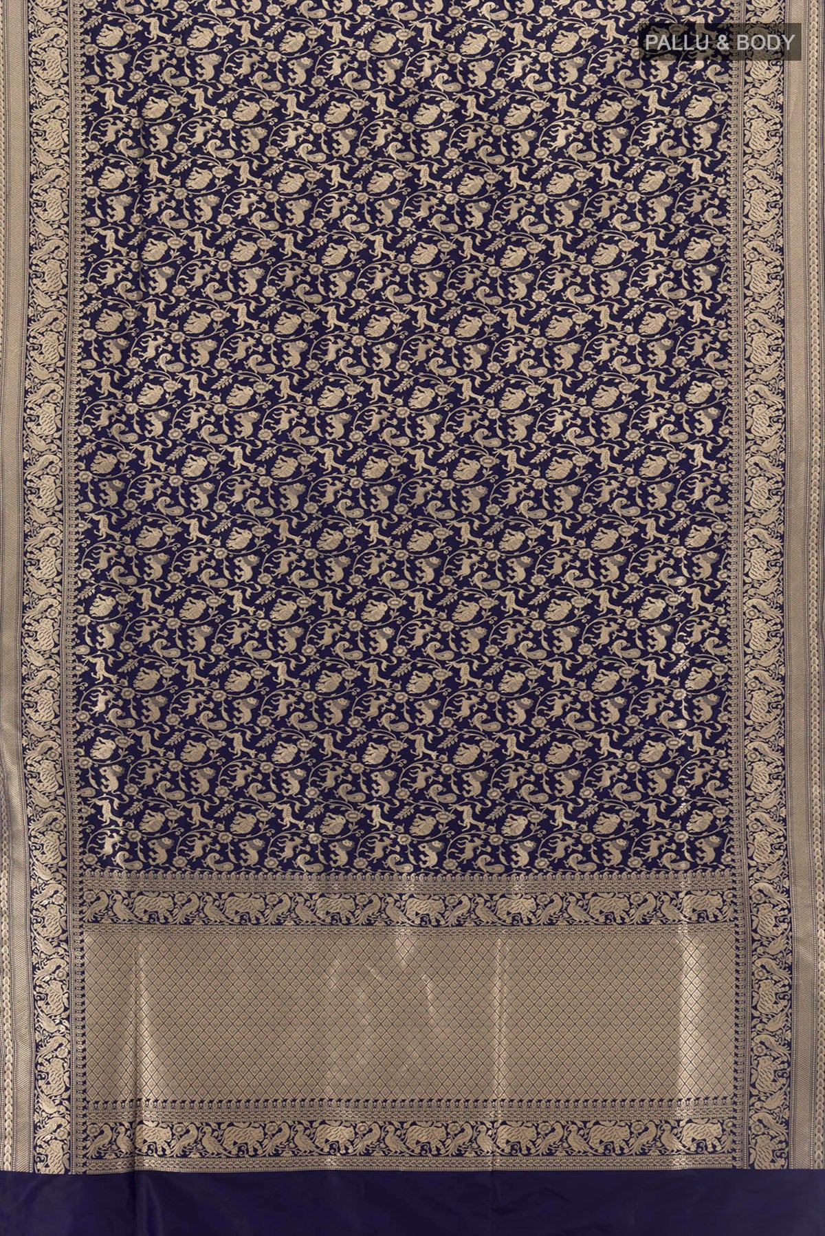 Flat view of Navy Blue Banarasi Silk Saree with Zari Butta on the body and Silk Border. 