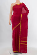 Maroon Kanchipuram Silk Saree with Plain Body and Silk Border.  displayed on a mannequin