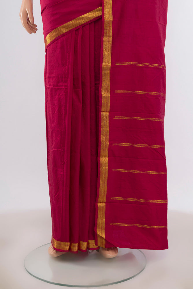 Pleats and pallu of Maroon Kanchipuram Silk Saree with Plain Body and Zari Border. 