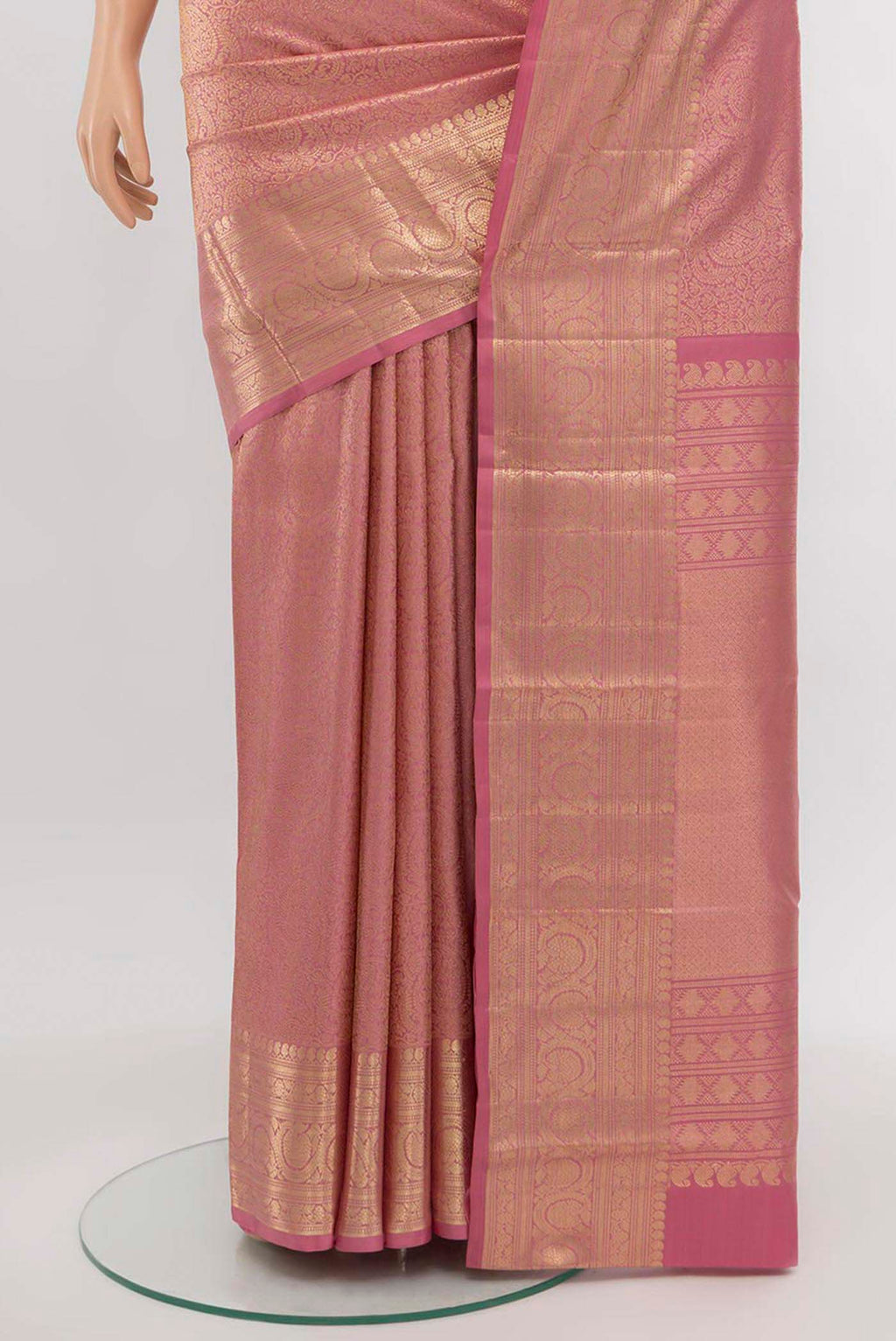 Pleats and pallu of Golden Peach Kanchipuram Silk Saree with Zari Butta on the body and Silk Border. 