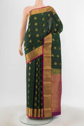 Bottle Green Kanchipuram Silk Saree with Jacquard With Zari Butta on the body and Zari Border.  displayed on a mannequin
