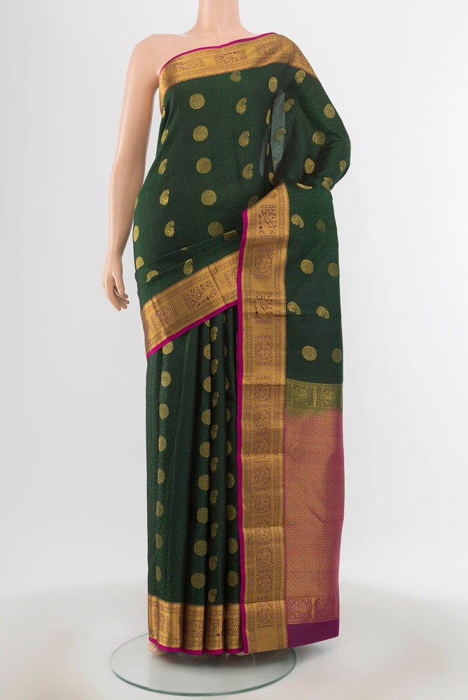 Bottle Green Kanchipuram Silk Saree with Jacquard With Zari Butta on the body and Zari Border.  displayed on a mannequin