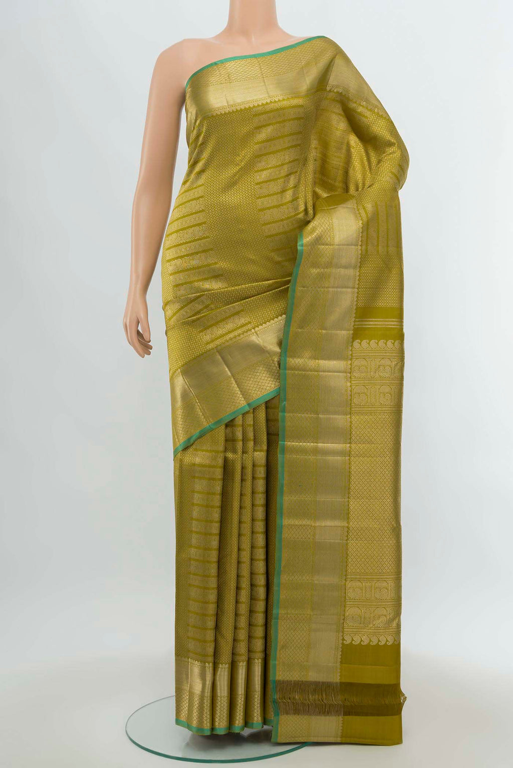 Mehandi Green Kanchipuram Silk Saree with Zari Butta on the body and Silk Border.  displayed on a mannequin