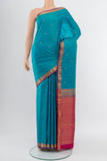 Light Blue Kanchipuram Silk Saree with Zari Butta on the body and Silk Border.  displayed on a mannequin