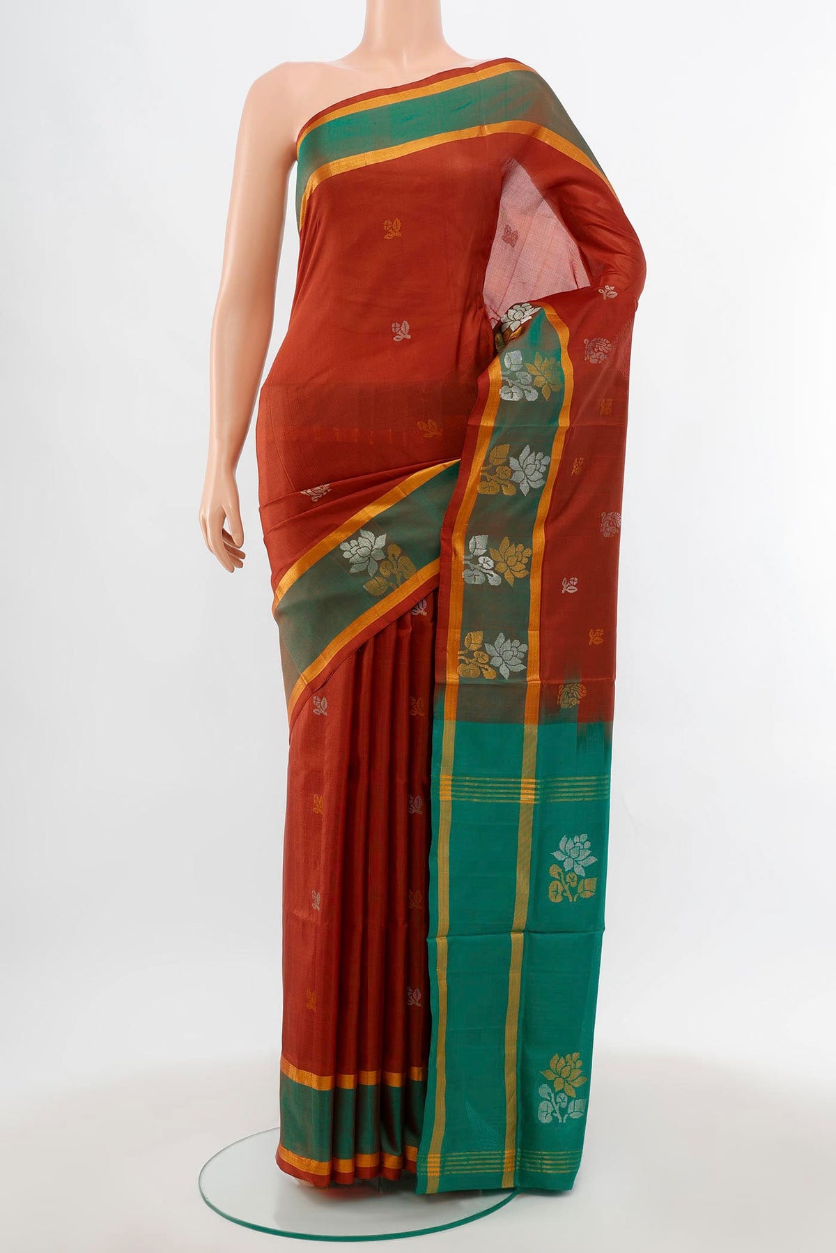 Brown Uppada Silk Saree with Zari Butta on the body and Silk Border.  displayed on a mannequin