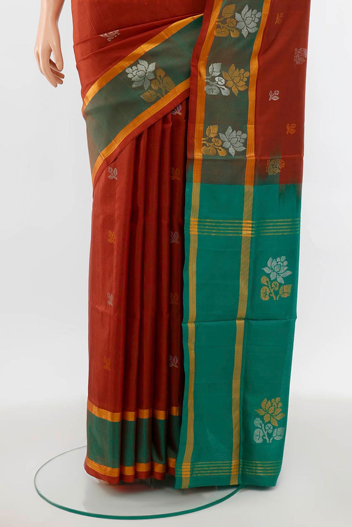 Pleats and pallu of Brown Uppada Silk Saree with Zari Butta on the body and Silk Border. 