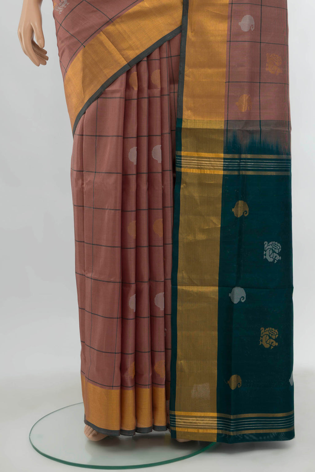 Pleats and pallu of Dark Beige Uppada Silk Saree with Zari Butta on the body and Silk Border. 