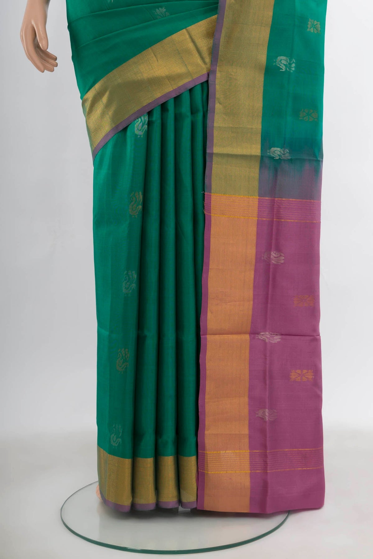 Pleats and pallu of Peacock Blue Uppada Silk Saree with Zari Butta on the body and Silk Border. 
