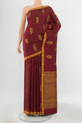 Pure Silk Pure Zari Maroon Kanchipuram Saree with Zari Butta on the body and Silk Border.  displayed on a mannequin