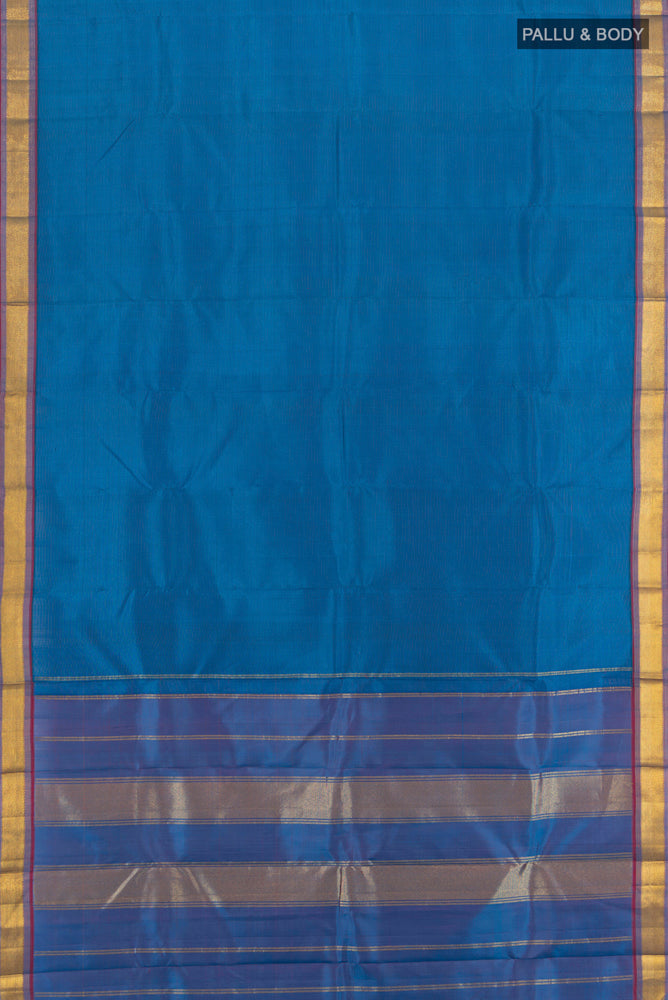 Flat view of Light Blue Kanchipuram Silk Saree with Zari Butta on the body and Silk Border. 