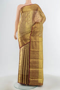 Golden Kanchipuram Silk Saree with Zari Butta on the body and Zari Border.  displayed on a mannequin