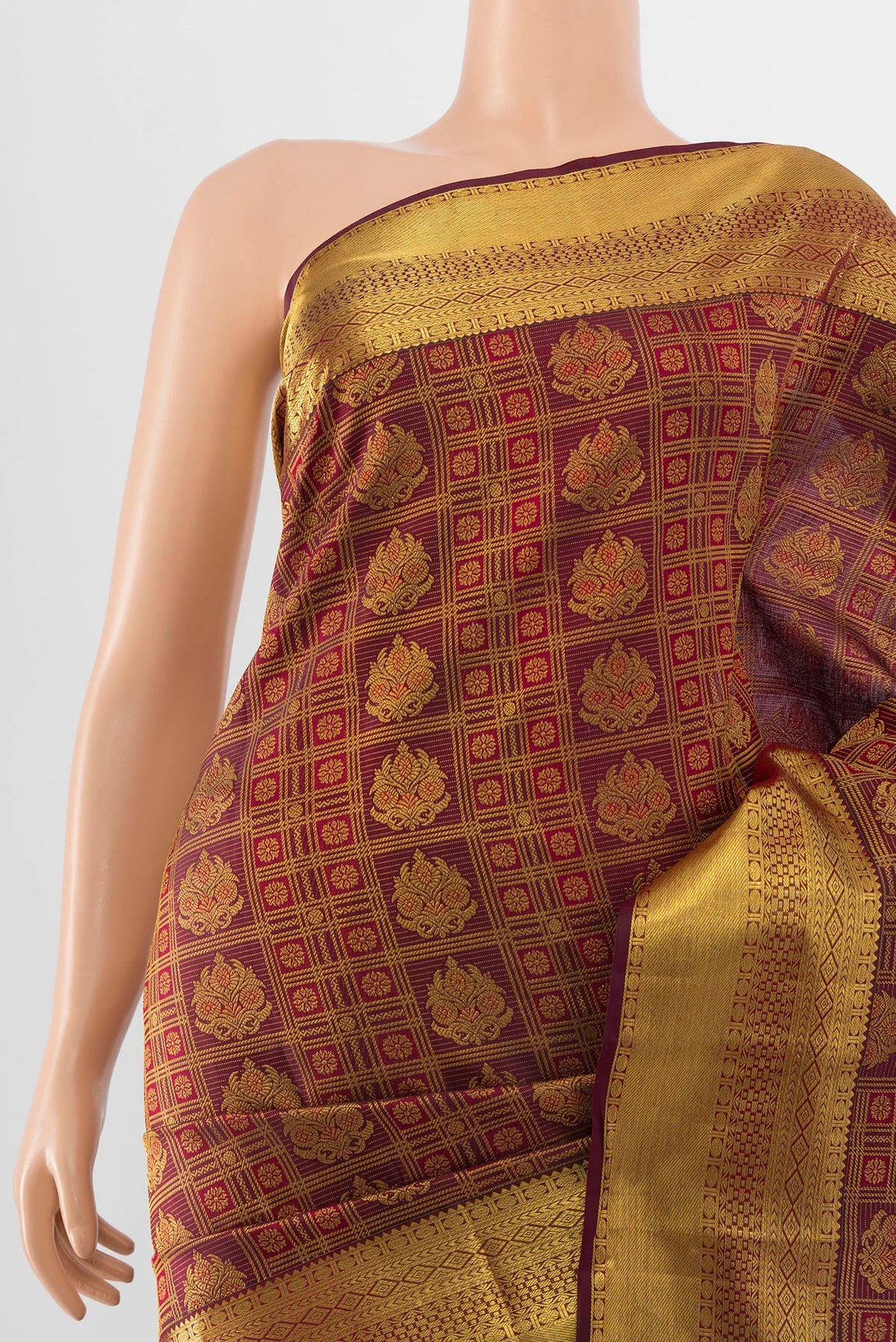 Border image of Pure Silk Pure Zari Maroon Kanjivaram Saree with Zari Butta on the body and Silk Border. 