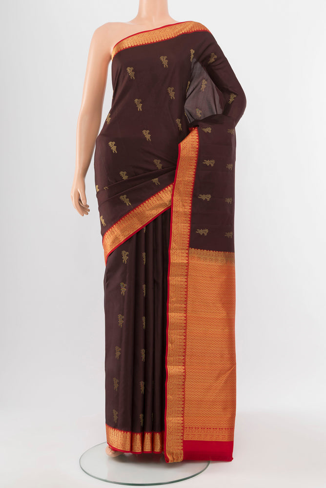 Coffee Brown Kanchipuram Silk Saree with Zari Butta on the body and Silk Border.  displayed on a mannequin