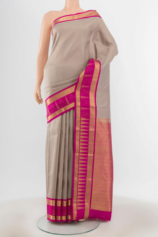 Grey Kanjivaram Silk Saree with Stripes on the body and Zari Border.  displayed on a mannequin