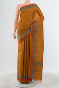Mustard Kanchipuram Silk Saree with Thread Butta on the body and Plain Border.  displayed on a mannequin
