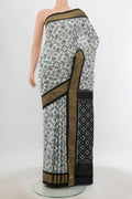 Multi Color Pochampally Saree with Ikat Print on the body and Silk Border.  displayed on a mannequin
