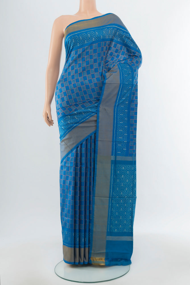 Blue Pochampally Saree with Ikat Print on the body and Silk Border.  displayed on a mannequin
