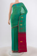 Green with Blue Color Kanchipuram Silk Saree with Zari Butta on the body and Zari And Thread Border.  displayed on a mannequin