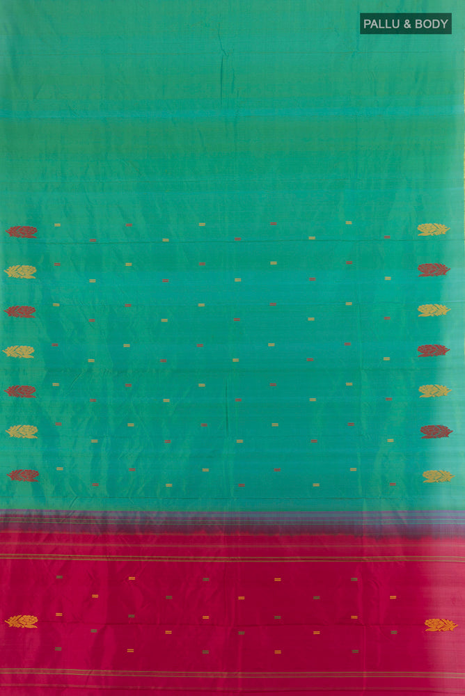 Flat view of Green with Blue Color Kanchipuram Silk Saree with Zari Butta on the body and Zari And Thread Border. 