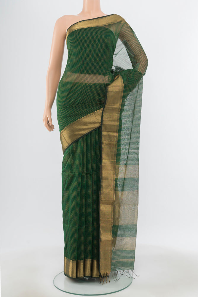 Pure Silk Pure Zari Bottle Green Maheshwari Cotton Saree with Zari Butta on the body and Silk Border.  displayed on a mannequin