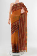 Mustard Kora Cotton Saree with Zari Butta on the body and Silk Border.  displayed on a mannequin