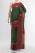 Pure Silk Pure Zari Bottle Green Kanjivaram Saree with Zari Butta on the body and Silk Border.  displayed on a mannequin