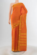 Mustard Kanjivaram Silk Saree with Zari Butta on the body and Zari Border.  displayed on a mannequin