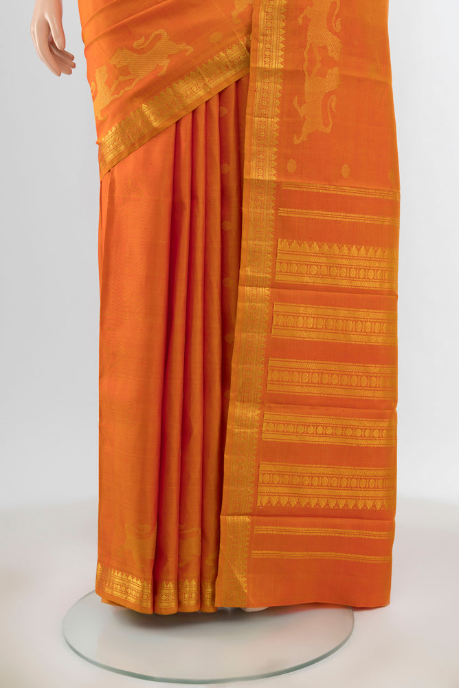 Pleats and pallu of Mustard Kanjivaram Silk Saree with Zari Butta on the body and Zari Border. 